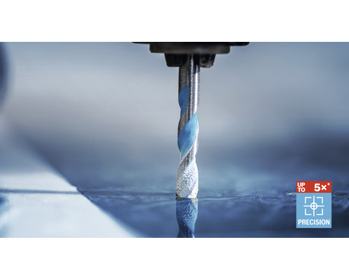 Spirálový vrták při vrtání se symbolem přesnosti