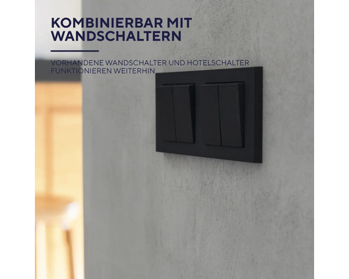 Černý dvojitý vypínač na zdi