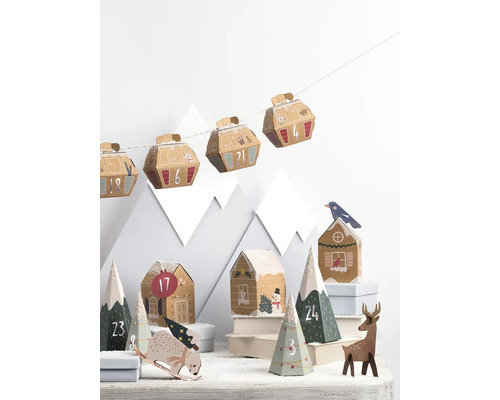 Vánoční dekorace s adventním kalendářem v designu gondol a domů a horské scenérie