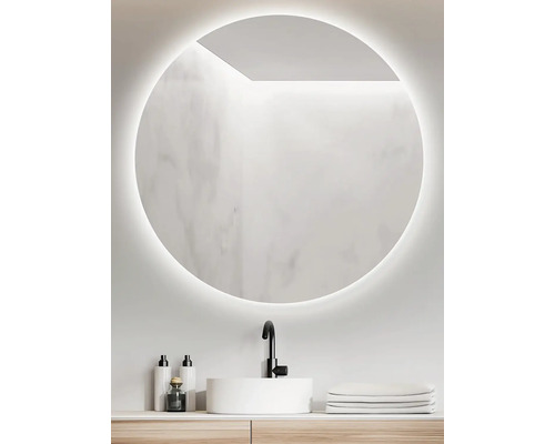 Kulaté zrcadlo s osvětlením nad umyvadlem v koupelně