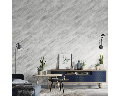 Obývací pokoj s pohovkou, stolem, komodou, pokojovými rostlinami a nástěnnými světly