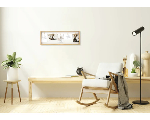 Obývací pokoj s dřevěným houpacím křeslem, stolem a rámem na fotografie