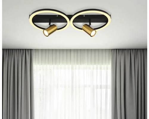 Stropní svítidlo se dvěma reflektory a kruhovým LED osvětlením v místnosti