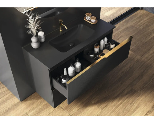 Černá skříňka pod umyvadlo s otevřenou zásuvkou v koupelně