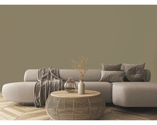 Obývací pokoj s pohovkou, polštáři, dekou a stolem