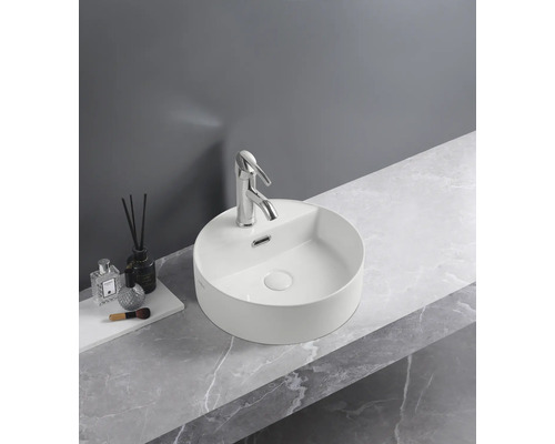 Kulaté umyvadlo na desku s baterií na umyvadlové desce