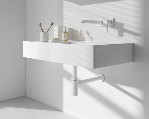 Moderní koupelna s umyvadlem, baterií a sifonem