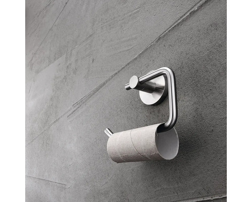Kovový držák toaletního papíru s prázdnou rolí papíru