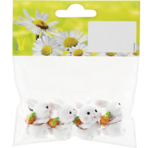 Sada dekorativních králičích figurek, balené pro prodej.