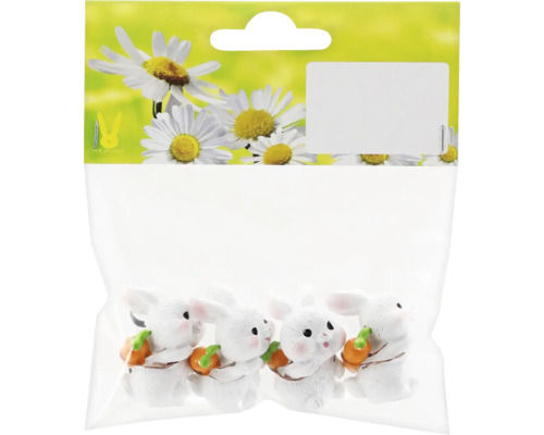 Sada dekorativních králičích figurek, balené pro prodej.