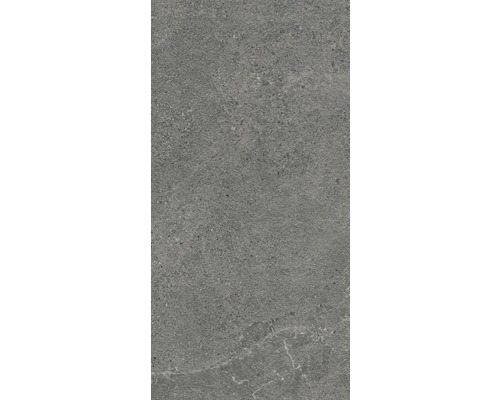 Šedá keramická dlaždice s matným povrchem.