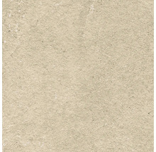 Detail béžové dlaždice s hrubou strukturou.