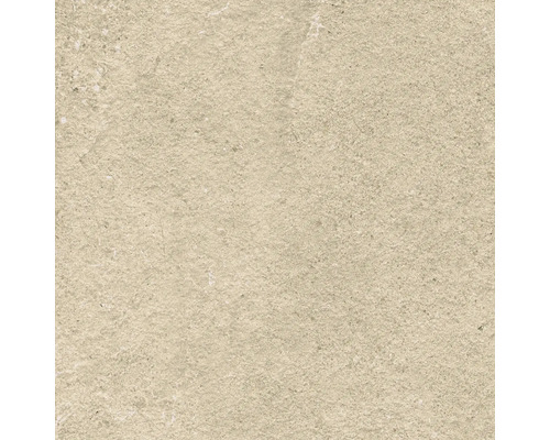 Detail béžové dlaždice s hrubou strukturou.