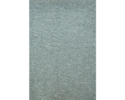 Detail světle zbarveného koberce.