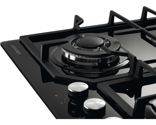 Detailní záběr na černou plynovou varnou desku s ovládacími knoflíky