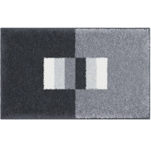 Koberec s geometrickým vzorem v různých odstínech šedé