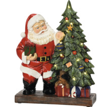 Santa Claus s vánočním stromkem a psem na dárcích