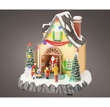 Vánoční dekorace osvětlený dům se Santa Clausem a dětmi