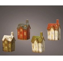 Čtyři ozdobné keramické domky s okenními otvory pro osvětlení