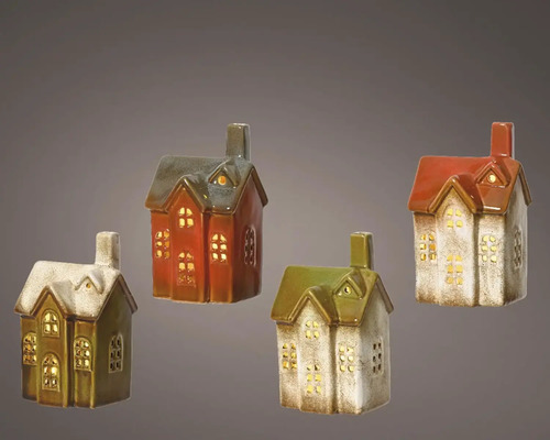 Čtyři ozdobné keramické domky s okenními otvory pro osvětlení