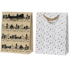 Dvě dárkové tašky s různými vzory: domy a hvězdy.