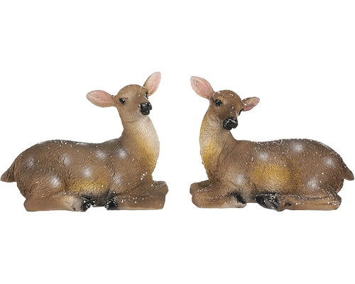 Dvě ležící figurky jelena jako dekorace