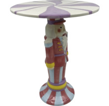 Dekorační stolek ve tvaru louskáčka s pruhovanou deskou stolu