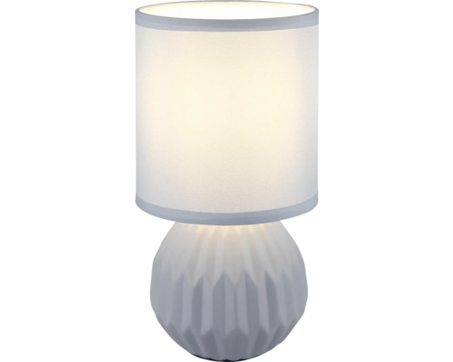 Stolní lampa s válcovým stínidlem a dekorativní základnou