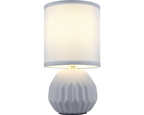 Stolní lampa s válcovým stínidlem a geometricky vzorovanou základnou