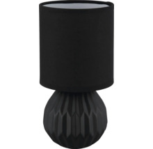 Dekorativní stolní lampa s geometrickým podstavcem a látkovým stínidlem.