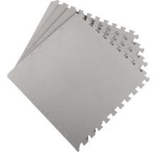 Několik šedých puzzle podložek