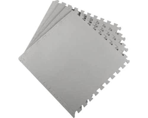 Několik šedých puzzle podložek