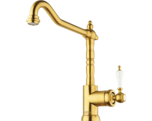 Zlatá kuchyňská baterie s porcelánovou rukojetí