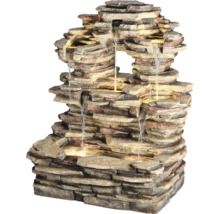 Dekorativní pokojová fontána vzhledu kamene s vodní hrou a osvětlením.