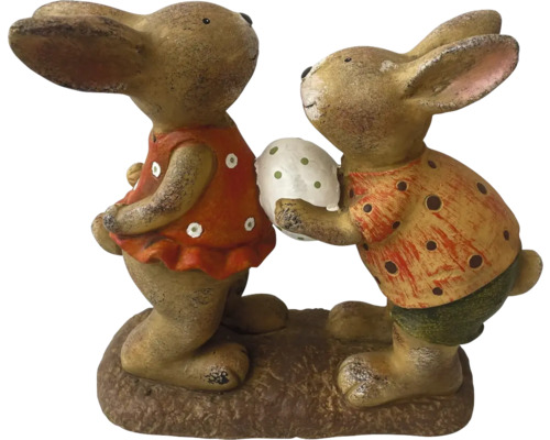 Dekorativní figurky zajíčků na podstavci, jedna figurka drží vejce
