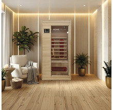 Infračervená sauna v světlé, moderní místnosti s dřevěnou podlahou a rostlinami