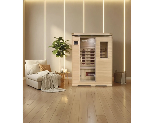 Infračervená sauna s lavicí a infračervenými zářiči ve světlé místnosti s dřevěnou podlahou