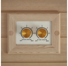 Detailní záběr ovládacího panelu se dvěma otočnými ovladači pro ovládání krční a bederní oblasti páteře sauny.