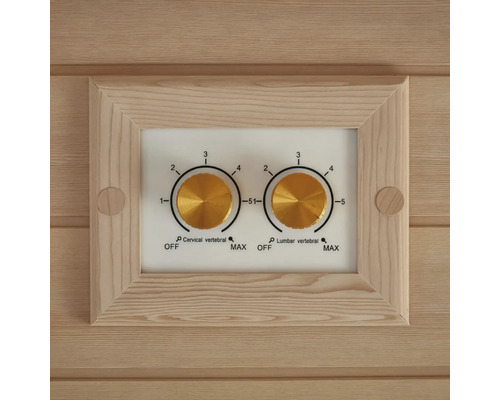 Detailní záběr ovládacího panelu se dvěma otočnými ovladači pro ovládání krční a bederní oblasti páteře sauny.