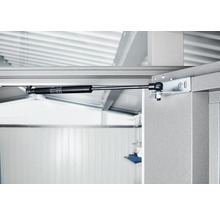 Detailní záběr plynové vzpěry na kovovém rámu