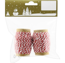 Dvě role červeno-bílé ozdobné stuhy v balení