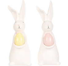 Dvě bílé velikonoční figurky zajíčků s vejcem