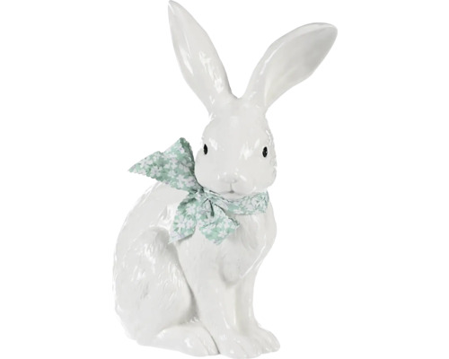 Dekorativní bílý zajíc s mašlí jako velikonoční dekorace