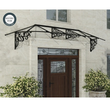 Kovová vchodová stříška s dekorativními ornamenty nad dřevěnými dveřmi na kamenné zdi, symbol pro registrovaný design.