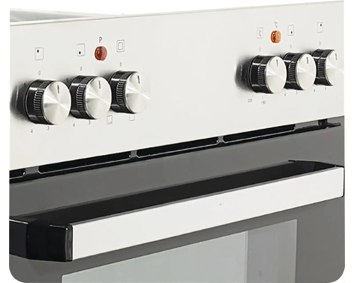 Detailní záběr sporáku s otočnými knoflíky