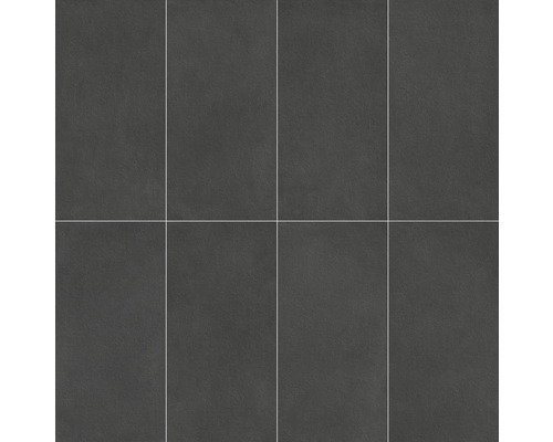 Obdélníkové, tmavé kameninové dlaždice, naskládané vedle sebe.