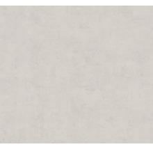 Strukturovaná tapeta se vzhledem omítky ve světlém odstínu.