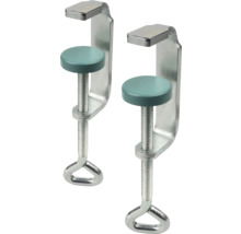 Dvě kovové šroubové svěrky s kulatými přítlačnými talíři a kruhovými rukojeťmi.