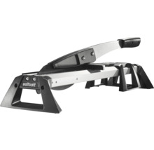 Řezačka laminátu Wolfcraft z kovu a plastu ve stříbrné a černé barvě s rukojetí a stabilním rámem.