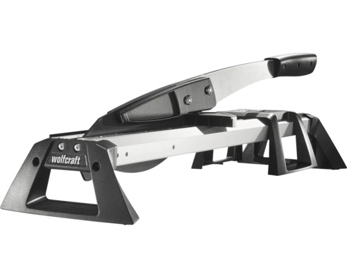 Řezačka laminátu Wolfcraft z kovu a plastu ve stříbrné a černé barvě s rukojetí a stabilním rámem.